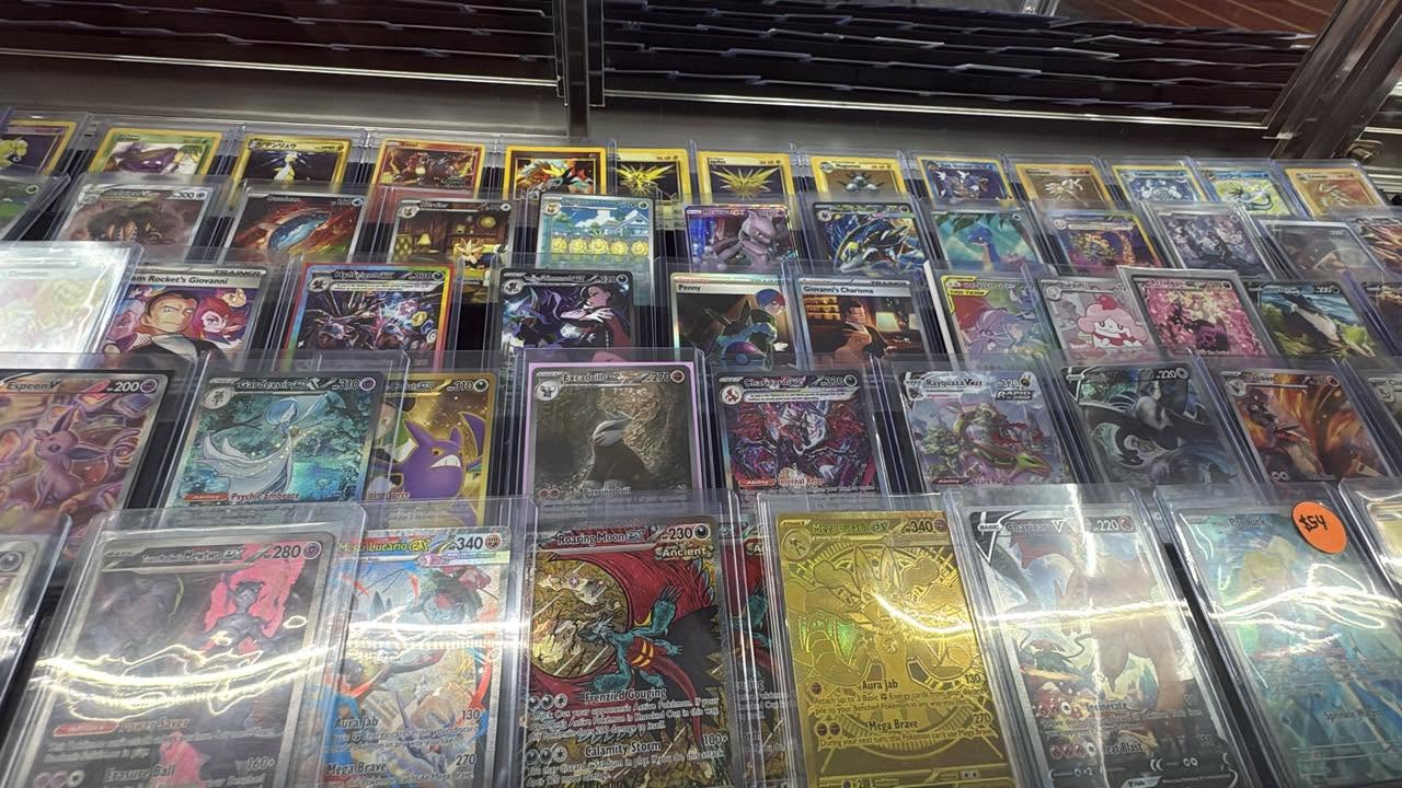 Pokémon singles in the CardHouse glass display case