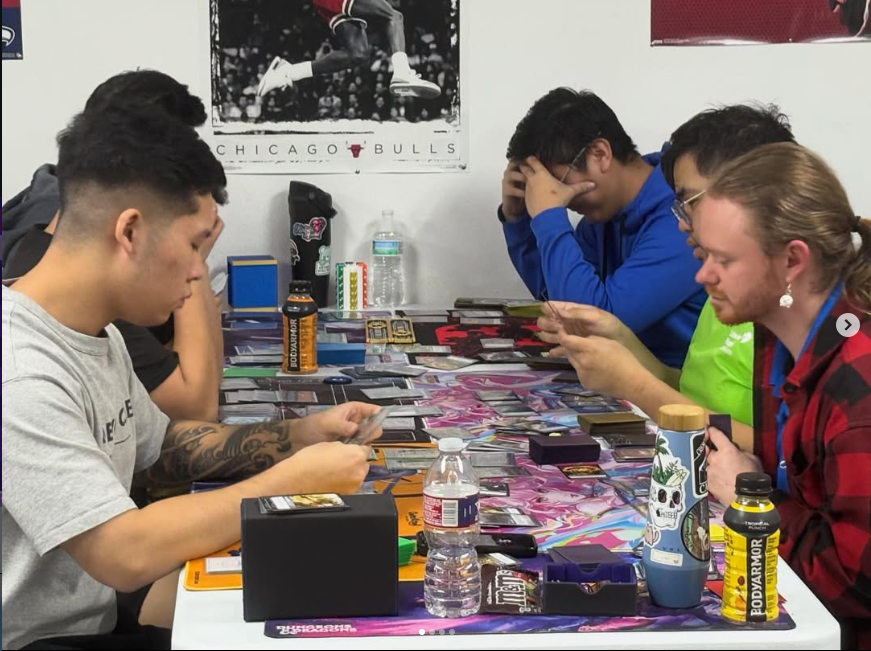 Pokémon players enjoying a match around a table at CardHouse